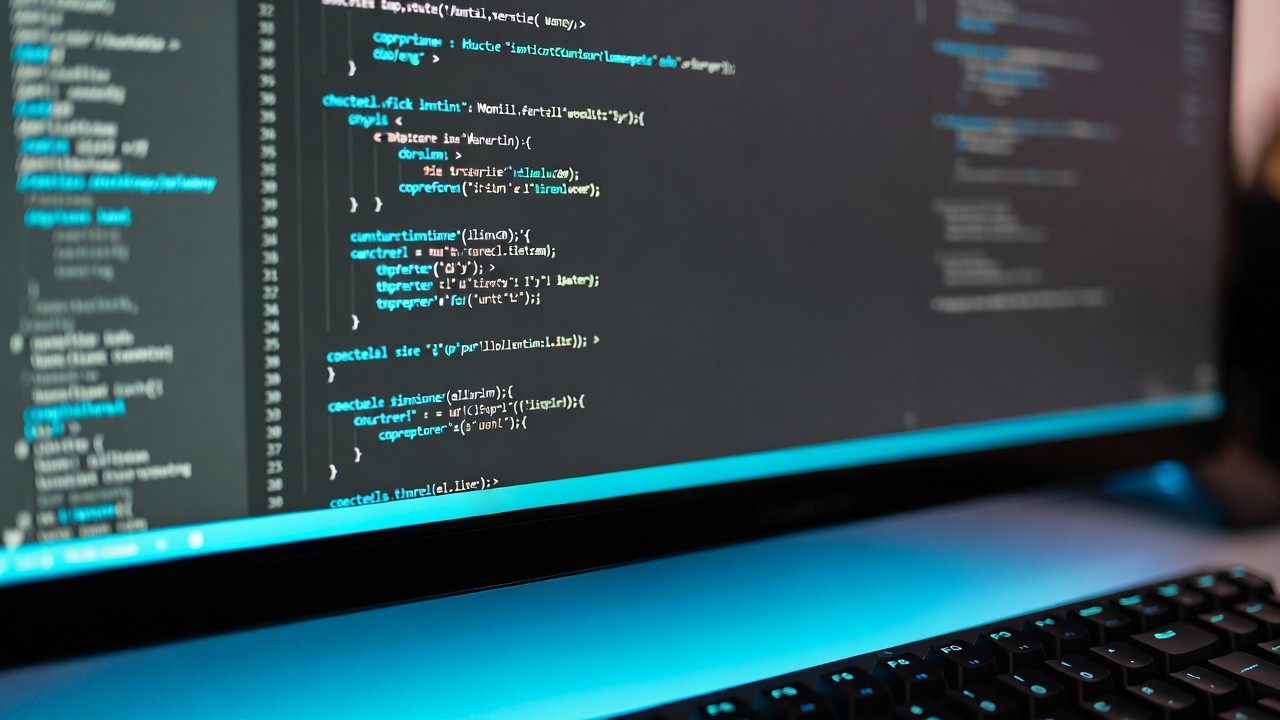A laptop showing clean modern code on a dark editor
